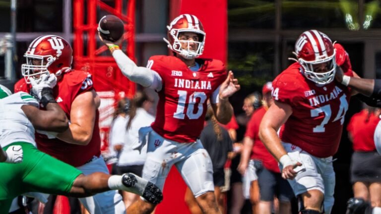 Indiana quarterback Josh Hoover throws a pass during game action