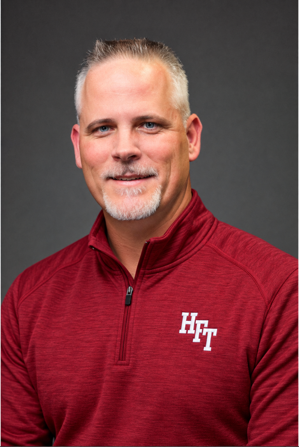 Coach Griff in a crimson HFT football pullover