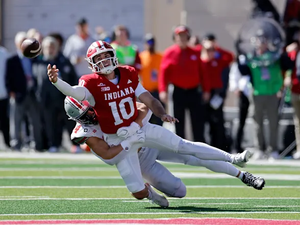Josh Hoover avoids a sack in the Ohio State Game Saturday